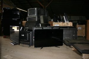 Stack of televisions awaiting recycling