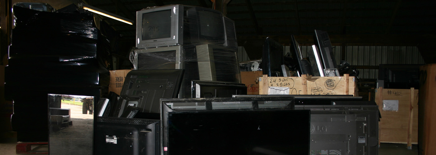Stacked CRT monitors and televisions at the recycling facility